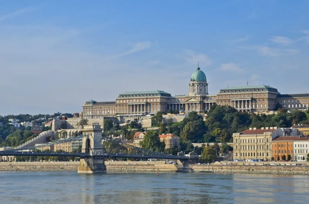Buda Castle above the Danube in Budapest, with the Chain Bridge crossing the river in front of it.