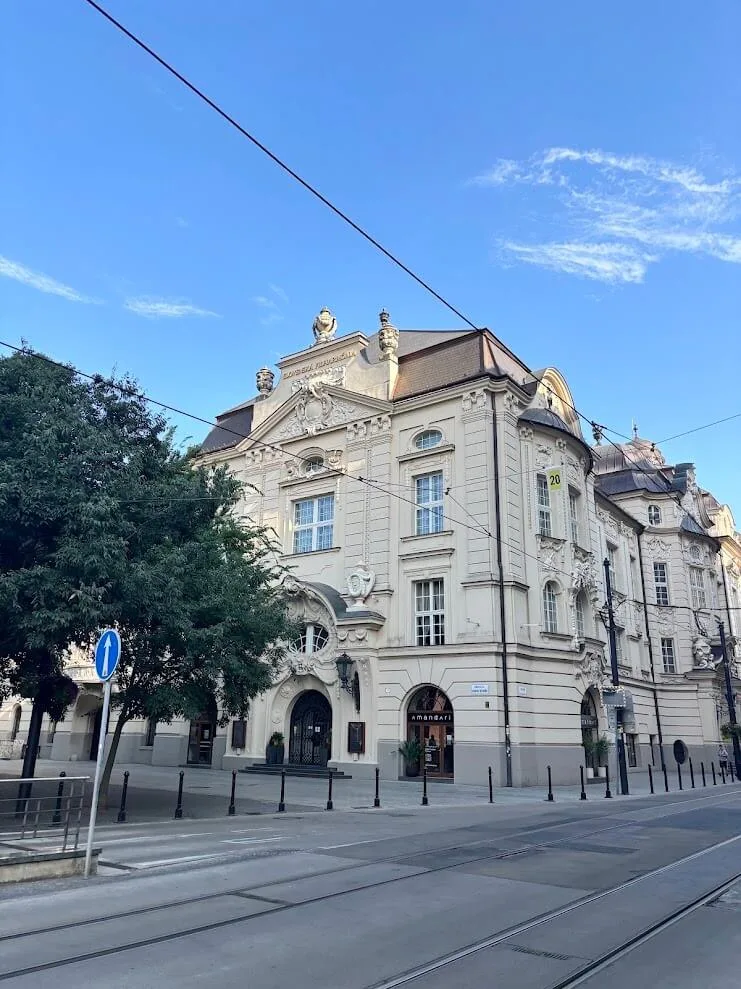 The Reduta building in Bratislava, home of the Slovak Philharmonic, with tram tracks running past its neo-baroque facade.