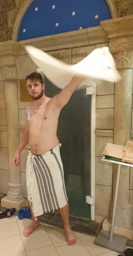 A man waving a towel during a sauna ritual in the sauna world at the Aphrodite spa in Rajecké Teplice.