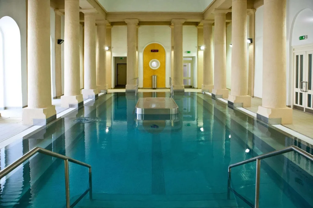 An indoor thermal pool lined with tall columns in Trenčianske Teplice.