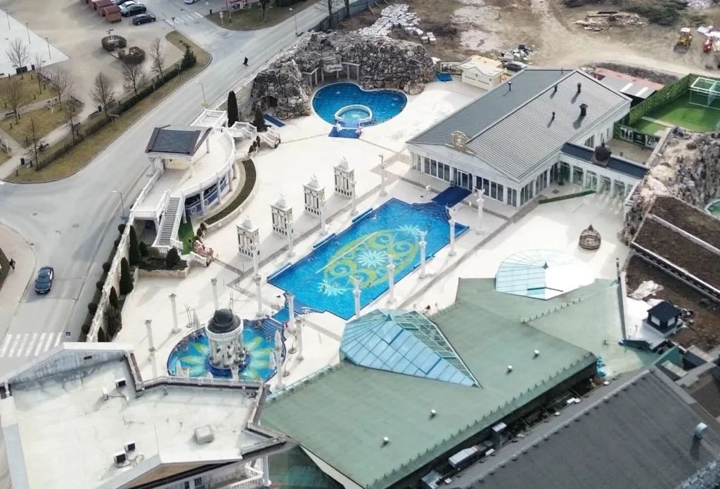 An aerial view of the colonnaded outdoor thermal pools of the Aphrodite spa at Rajecké Teplice.