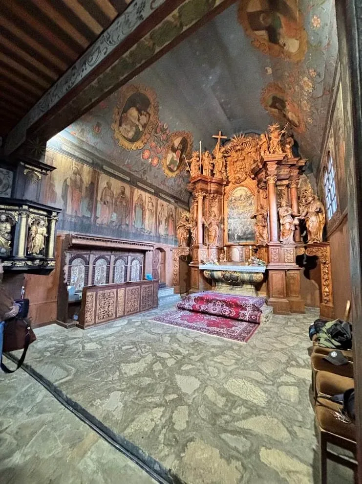 The painted interior of the wooden church at Tvrdošín, its walls and ceiling covered in folk-baroque decoration.