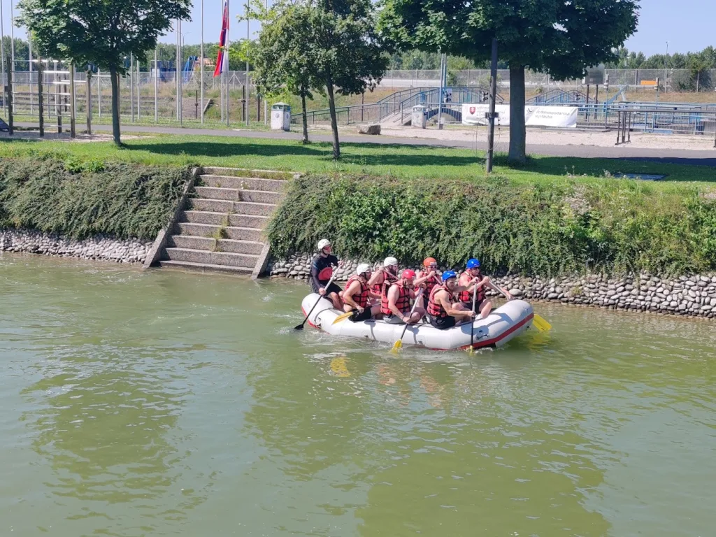 A team paddling a white raft down the white-water channel at the Čunovo water sports centre south of Bratislava.