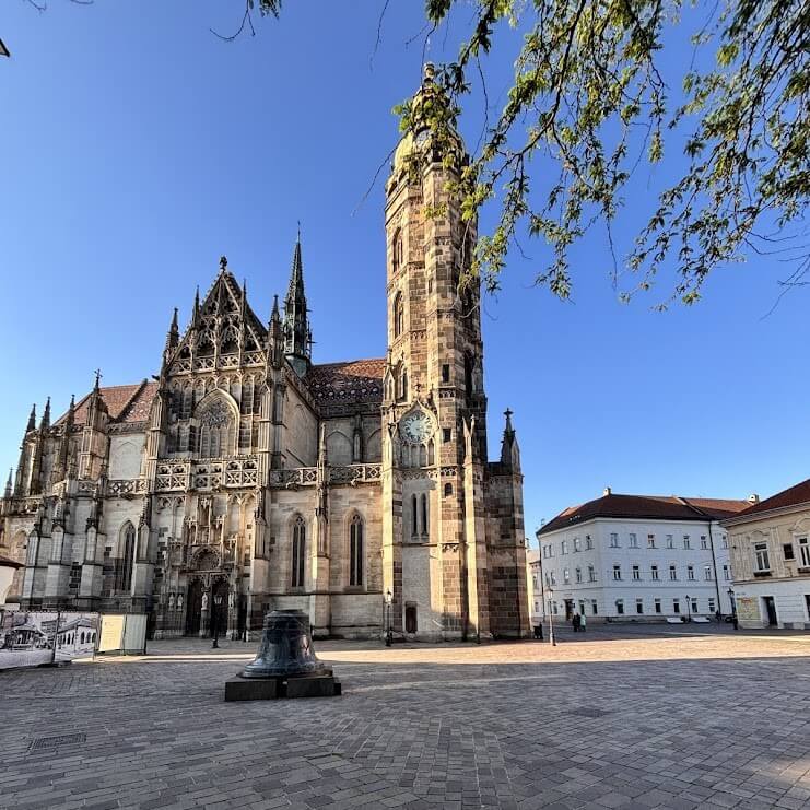 St. Elisabeth Cathedral in Kosice featuring tall Gothic tower and intricate architecture in main square on sunny day with clear blue sky