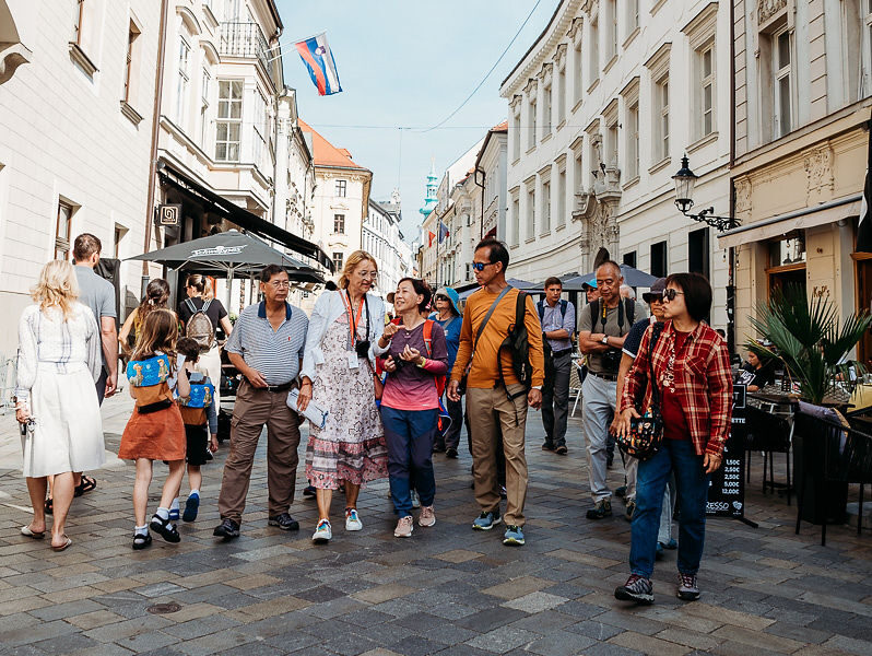 the picture of Asiatic clients strolling thru historical city center of Bratislava, E-TRAVEL.SK